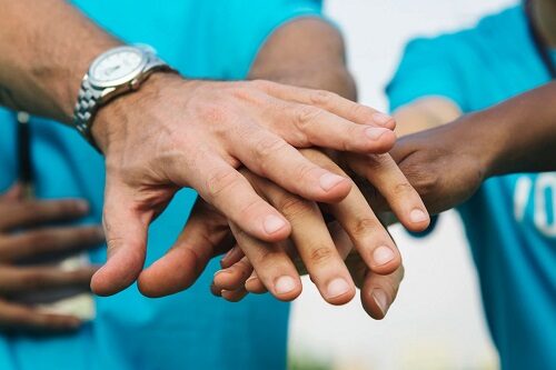 team-volunteers-stacking-hands_53876-30767